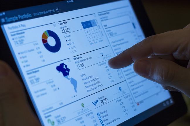 Hand on touch screen tablet