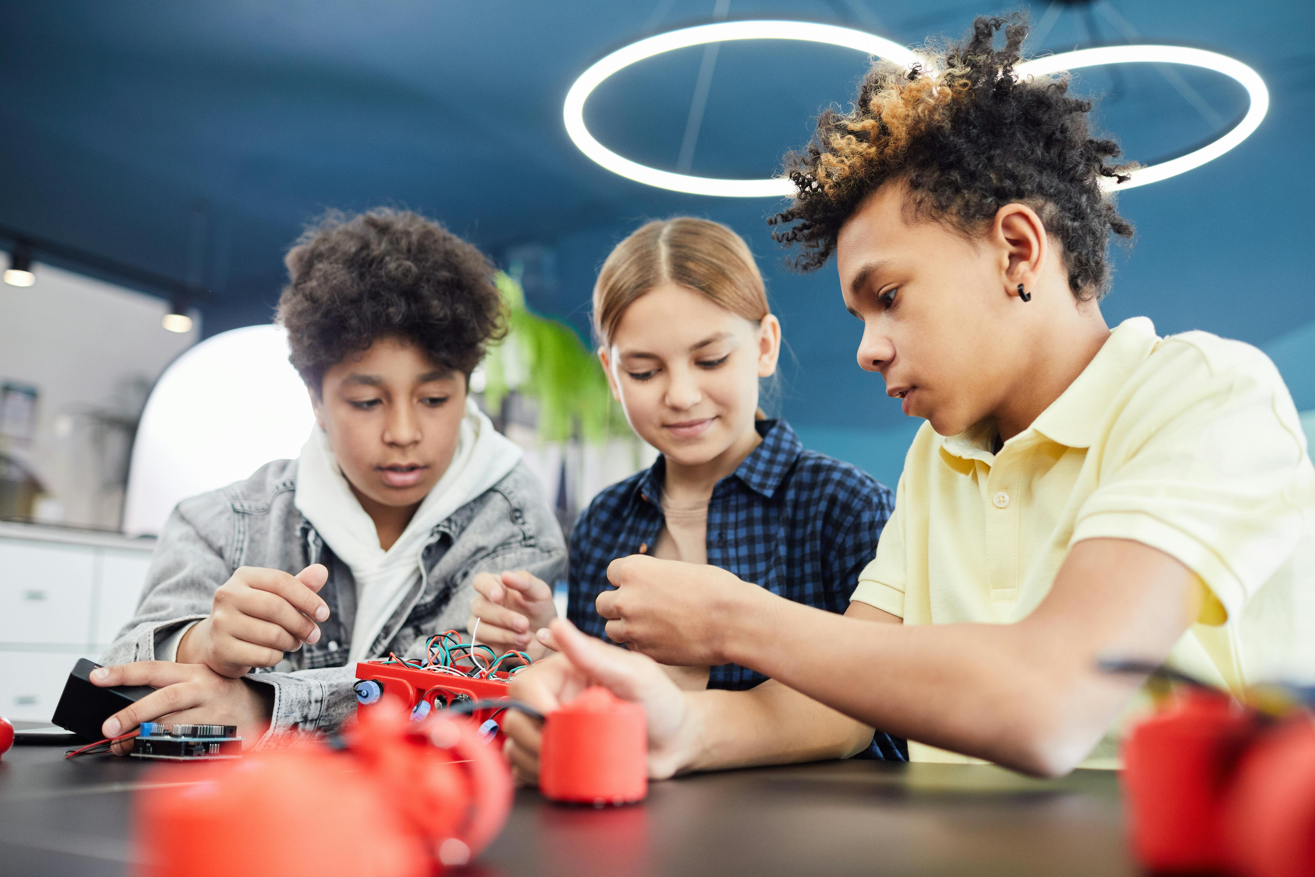 Learning experiences bring multiple skills together in practice Students working on a robotics project