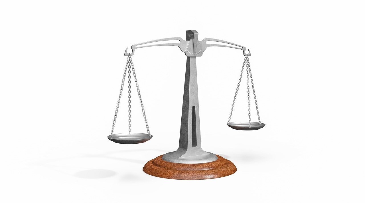 A pair of balance scales, like 'scales of justice'