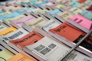 Many film script books stacked an top of each other