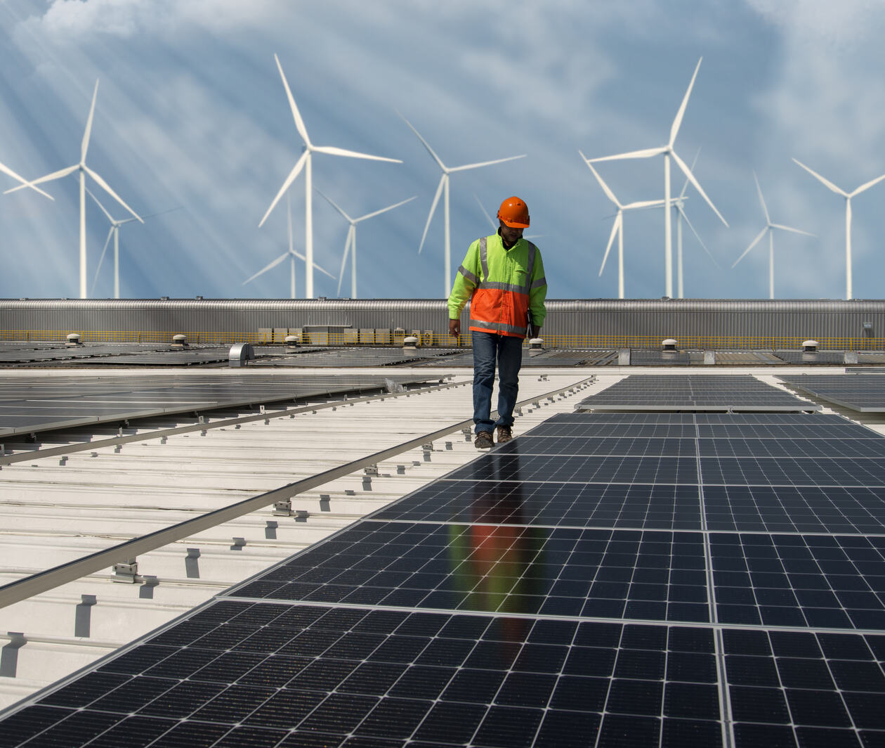 Inspector Engineer Man Holding Digital Tablet Working in Solar Panels Power Farm, Photovoltaic Cell Park, Green Energy Concept.