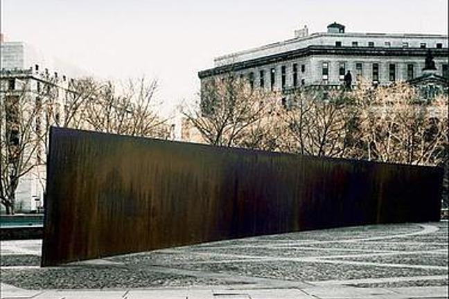A photograph of Richard Serra's Tilted Arc in its original location