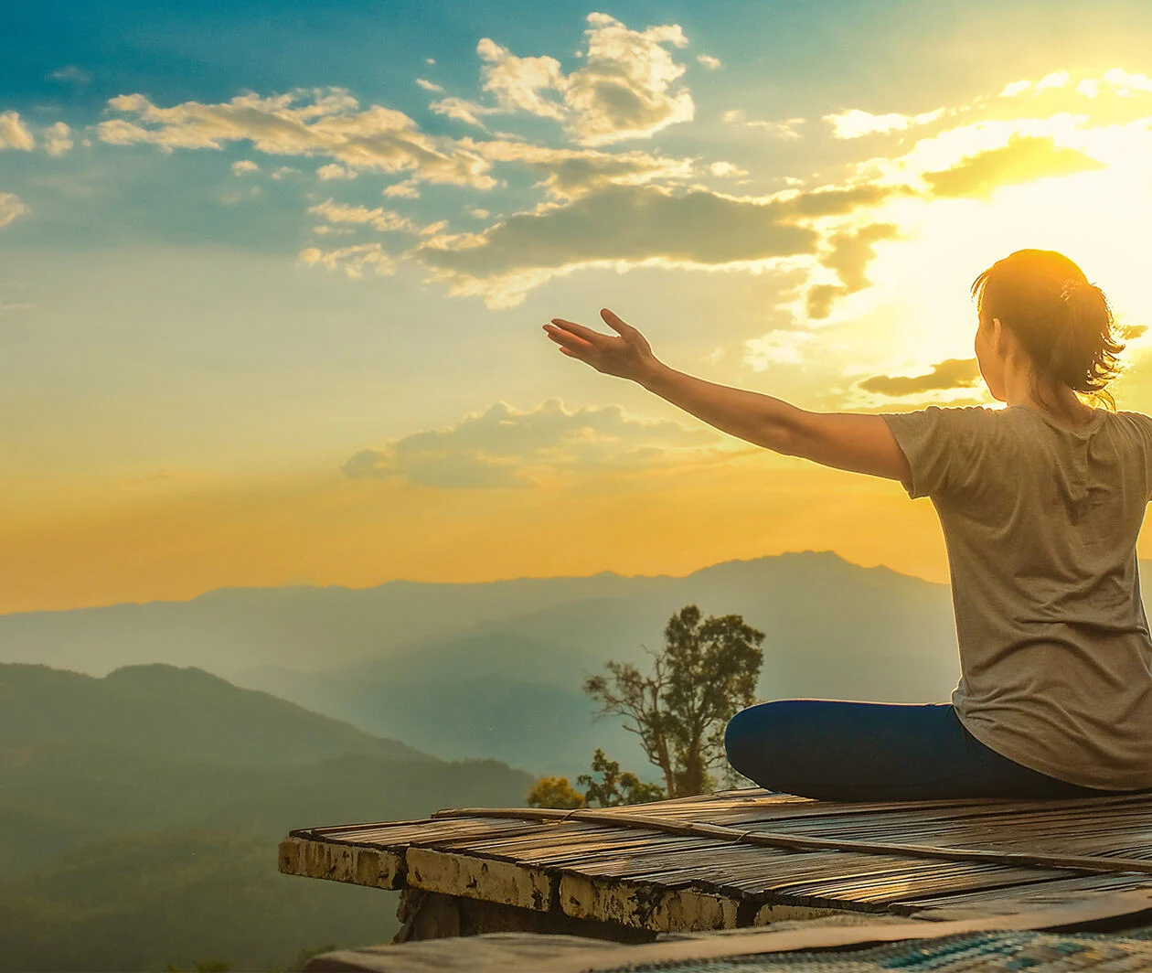 Healthy woman lifestyle balanced practicing meditate and zen energy yoga outdoors on the bridge in morning the mountain nature. Healthy life Concept.