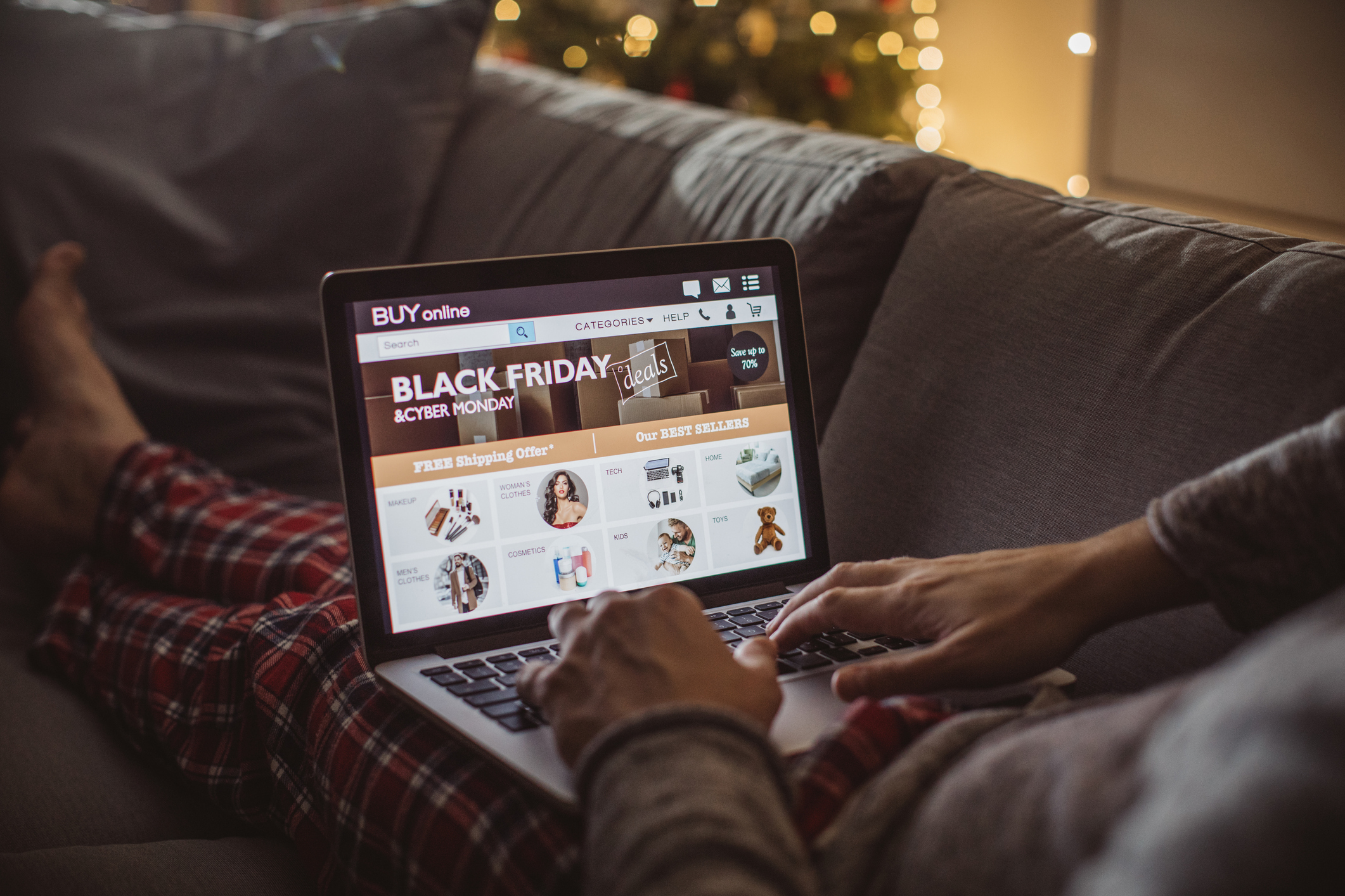 An eCommerce platform on a laptop, with a person browsing online.