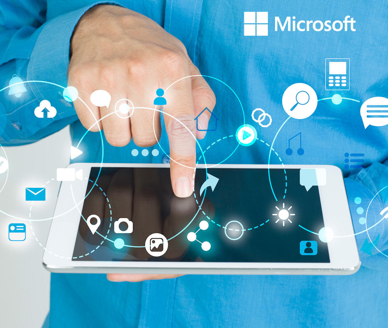 A hand floating over a computer tablet screen, with digital icons spiralling around the hand and tablet. Amongst the icons are cloud computing symbols, and other management tool icons.