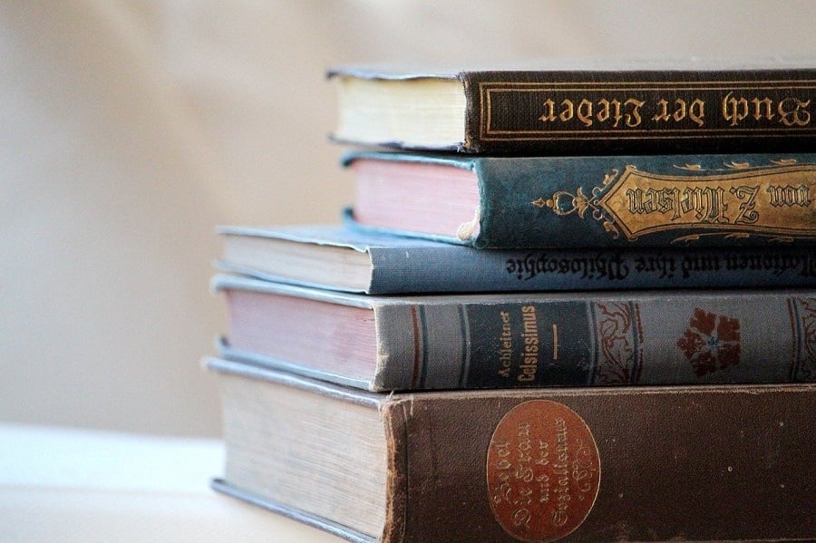 Pile of old books on a table