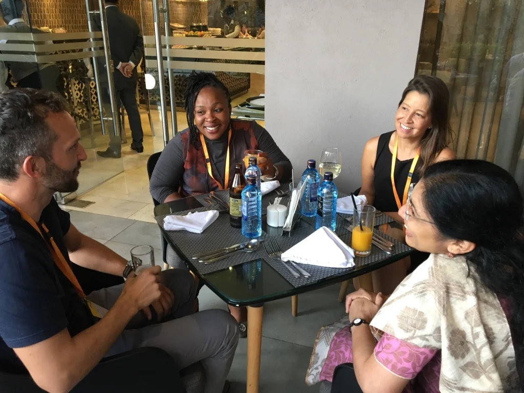 Group of learners relaxing in a cafe