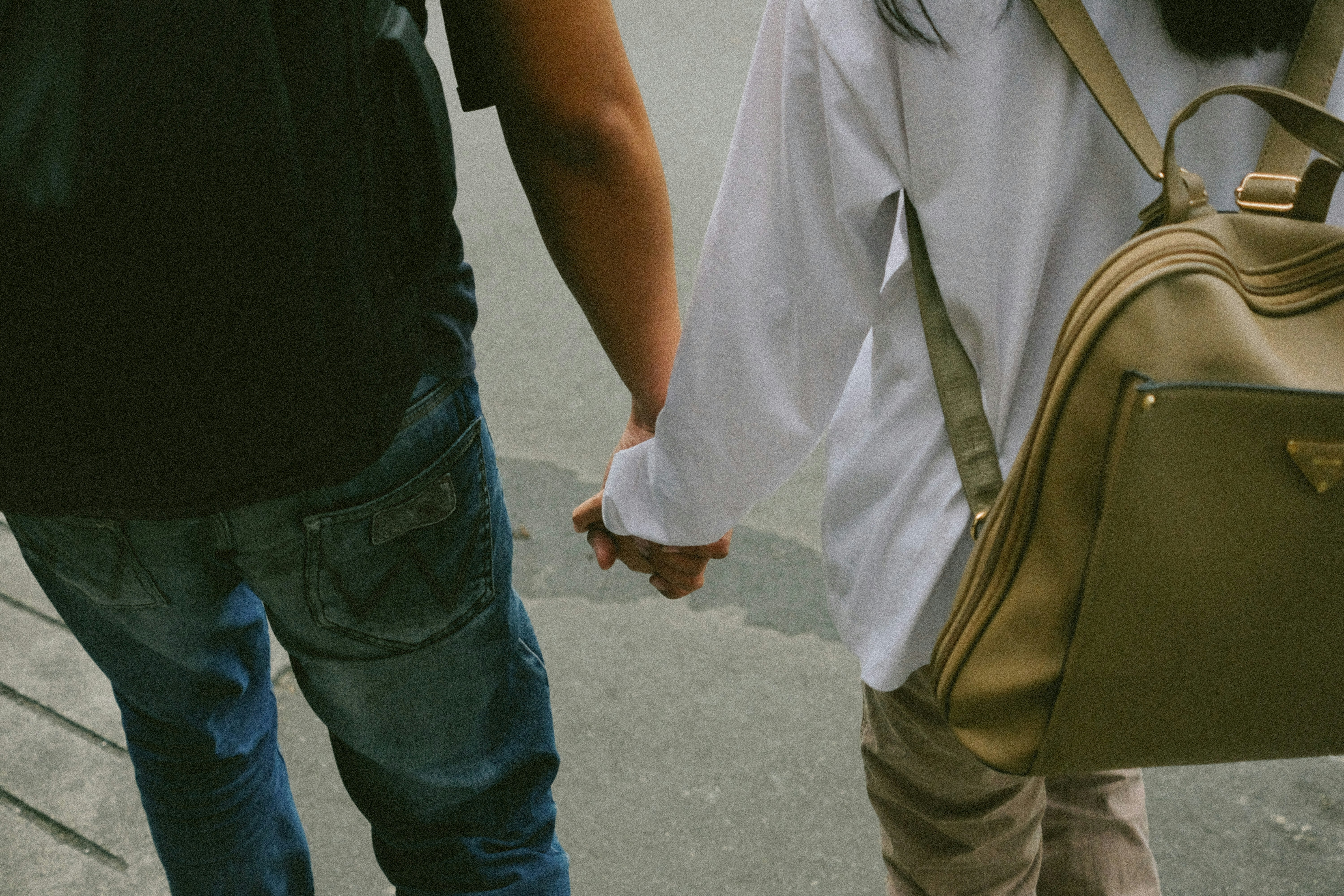 Couple holding hands in the city