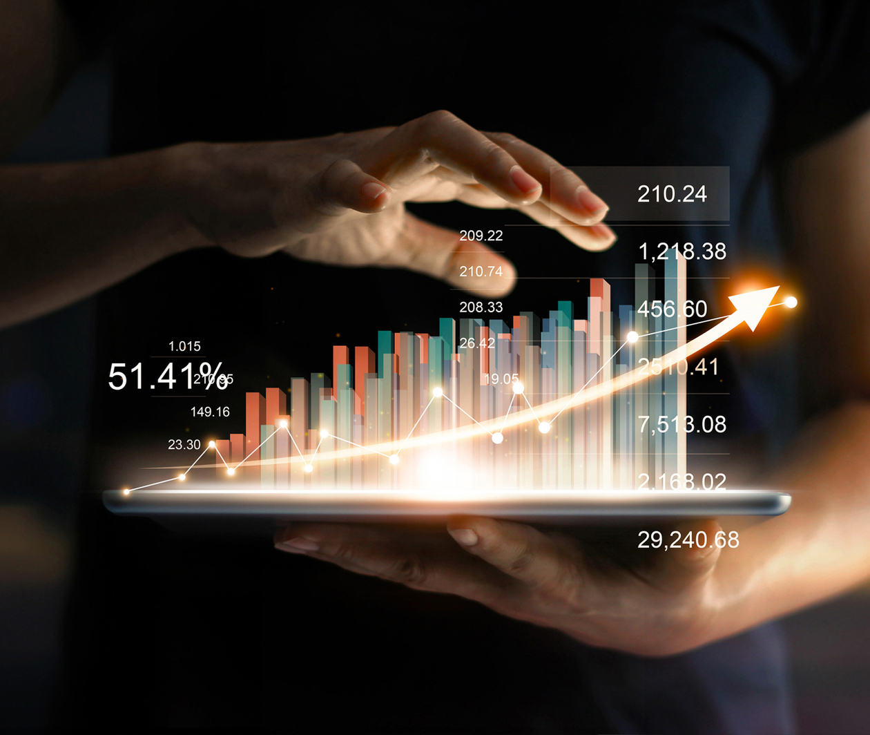 Businessman holding tablet and showing a growing virtual hologram of statistics