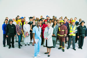 A group photograph of people representing a wide range of jobs in the public sphere.