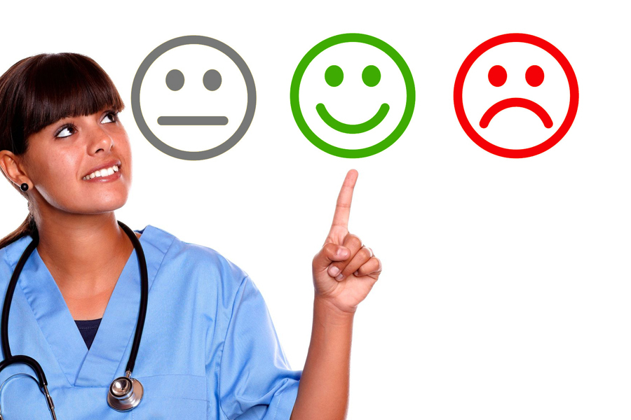 Image shows nurse with three face icons, happy, straight and frown. She is pointing at the happy icon.