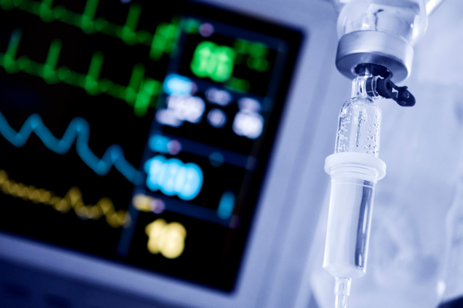 Intensive care scene with a stats monitor and IV drip