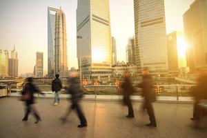 People rushing in a central business district