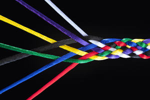Strands of an interwoven multicoloured piece of rope