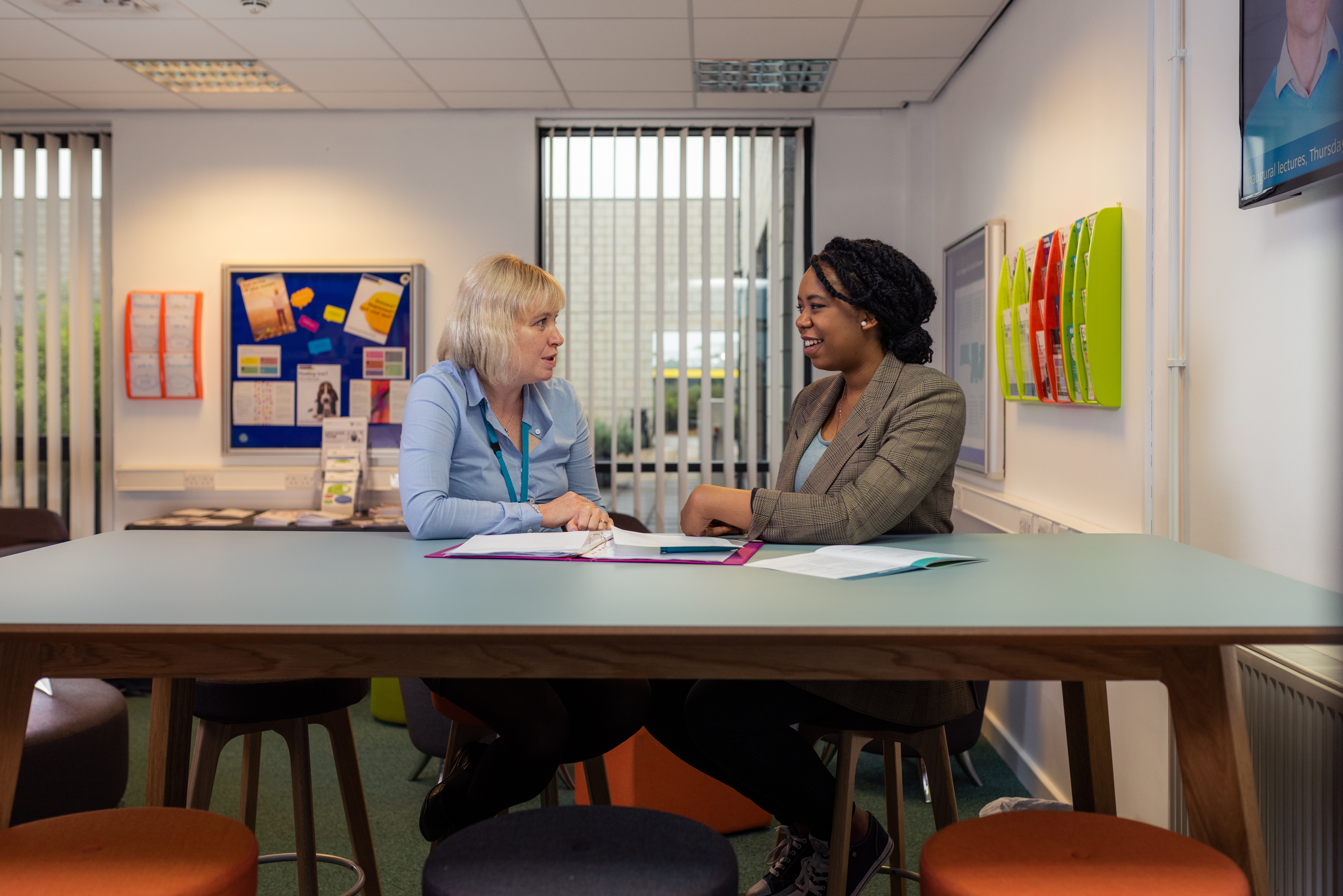 Student and tutor sat talking