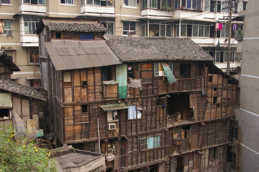 Shibati in Yuzhong District (Chongqing) is one of the many slums in China. The slum is surrounded by recent constructed high rise residential buildings. Chinese government has demolished and cleared numerous slums like Shibati.