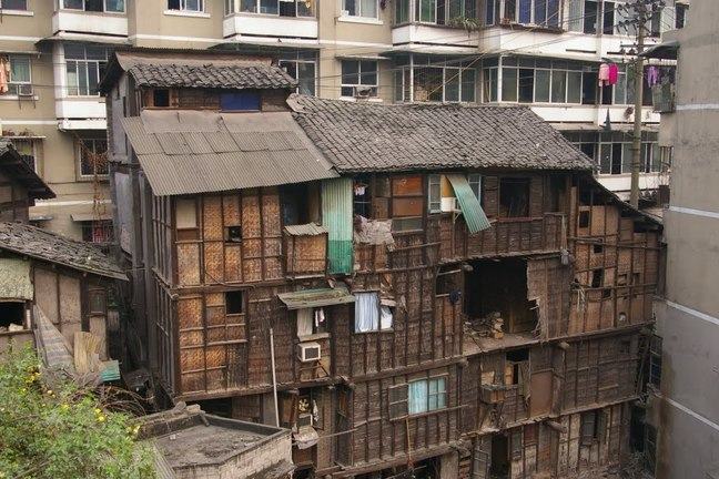 Shibati in Yuzhong District (Chongqing) is one of the many slums in China. The slum is surrounded by recent constructed high rise residential buildings. Chinese government has demolished and cleared numerous slums like Shibati.