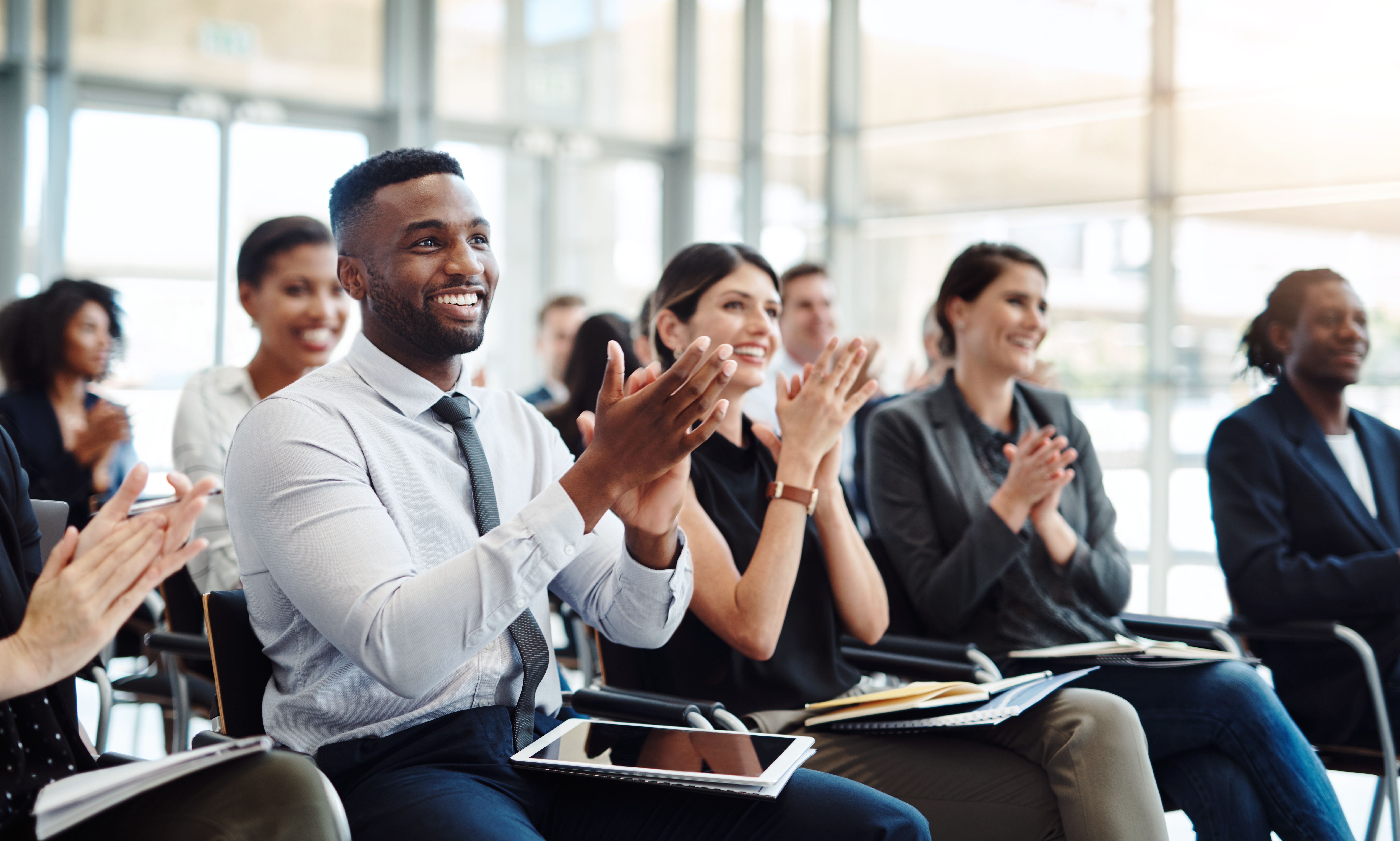 An audience responding positively to a good idea.