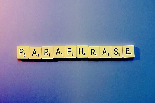 The word 'paraphrase' spelled out in letter tiles.