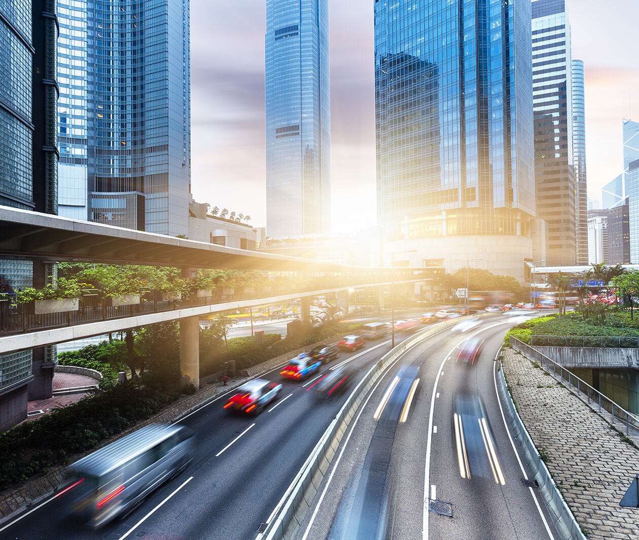 Busy urban road network with skyscrapers in the background