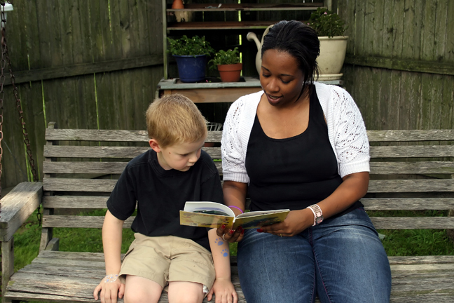 woman reads to a child