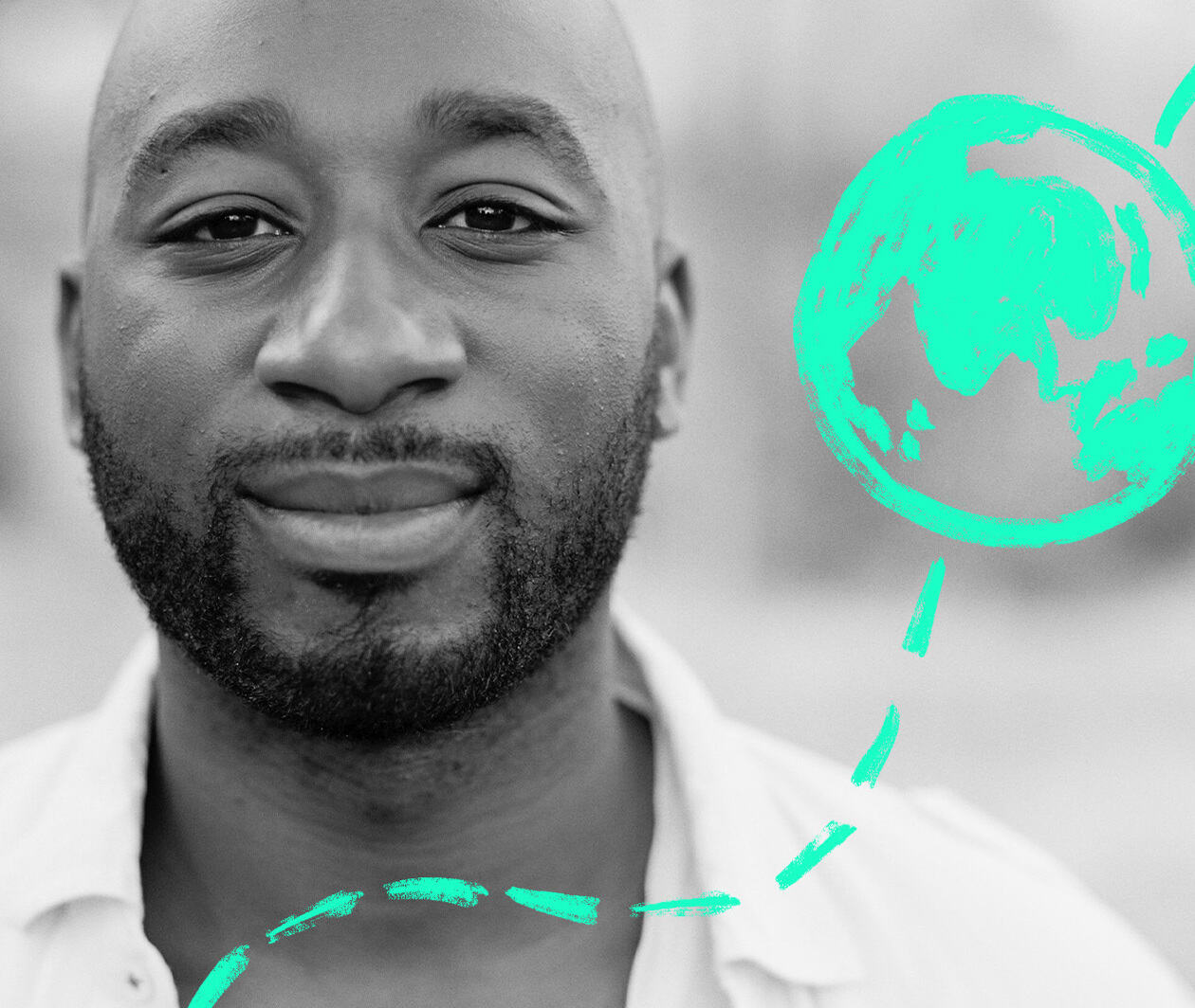 A black and white picture of Charles Holgate, Creative Director of Raider_Zero. In the foreground, a simple globe, drawn in luminous green marker appears to travel from the bottom of the picture to the top.