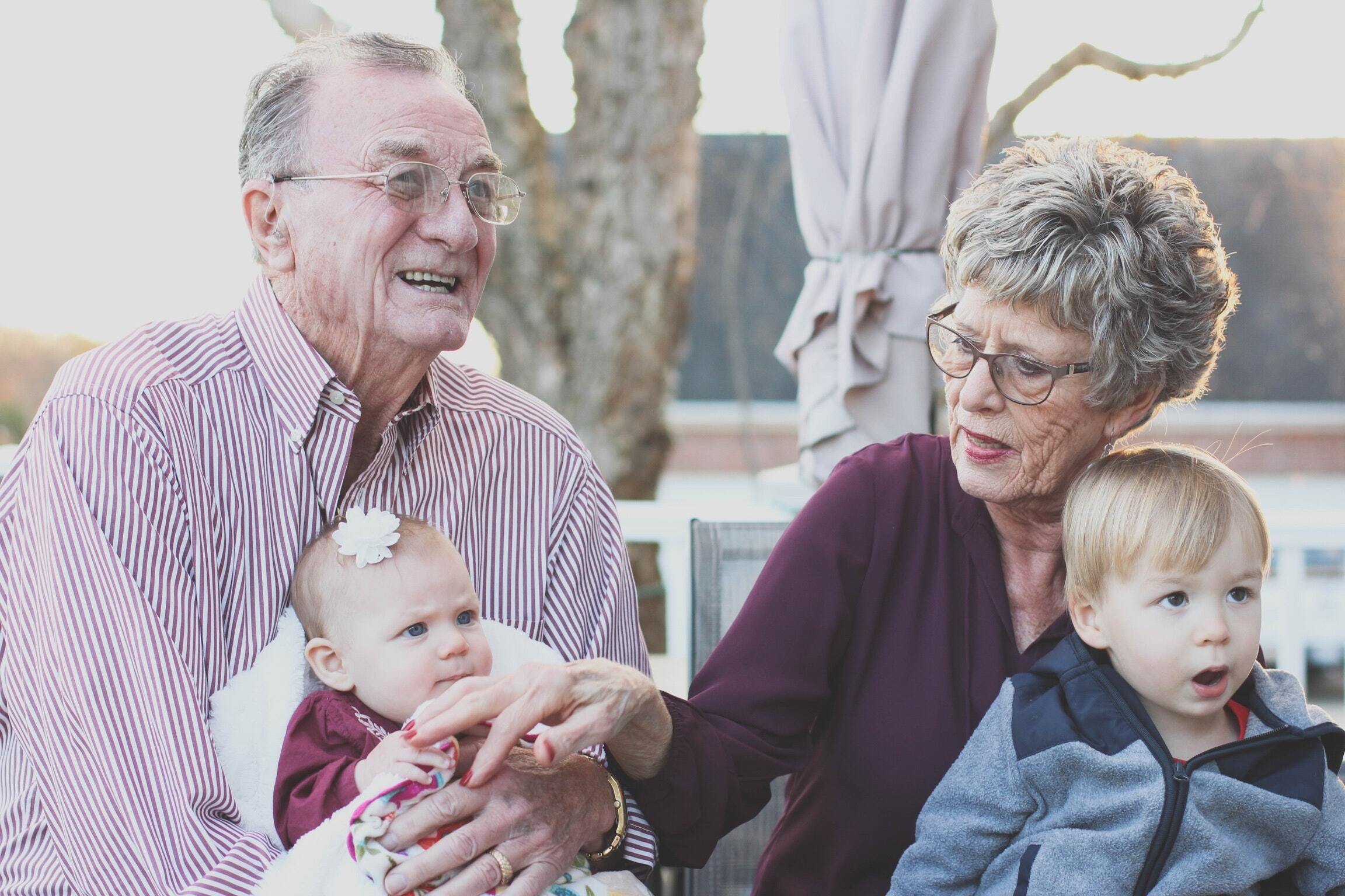 A family portrait portraying grandparents and their two grandchildren.