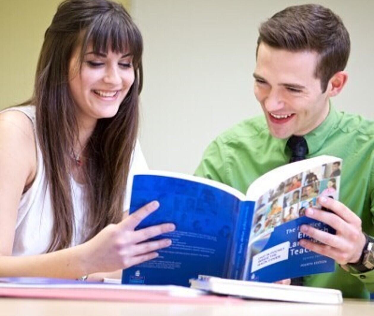 two people reading a book