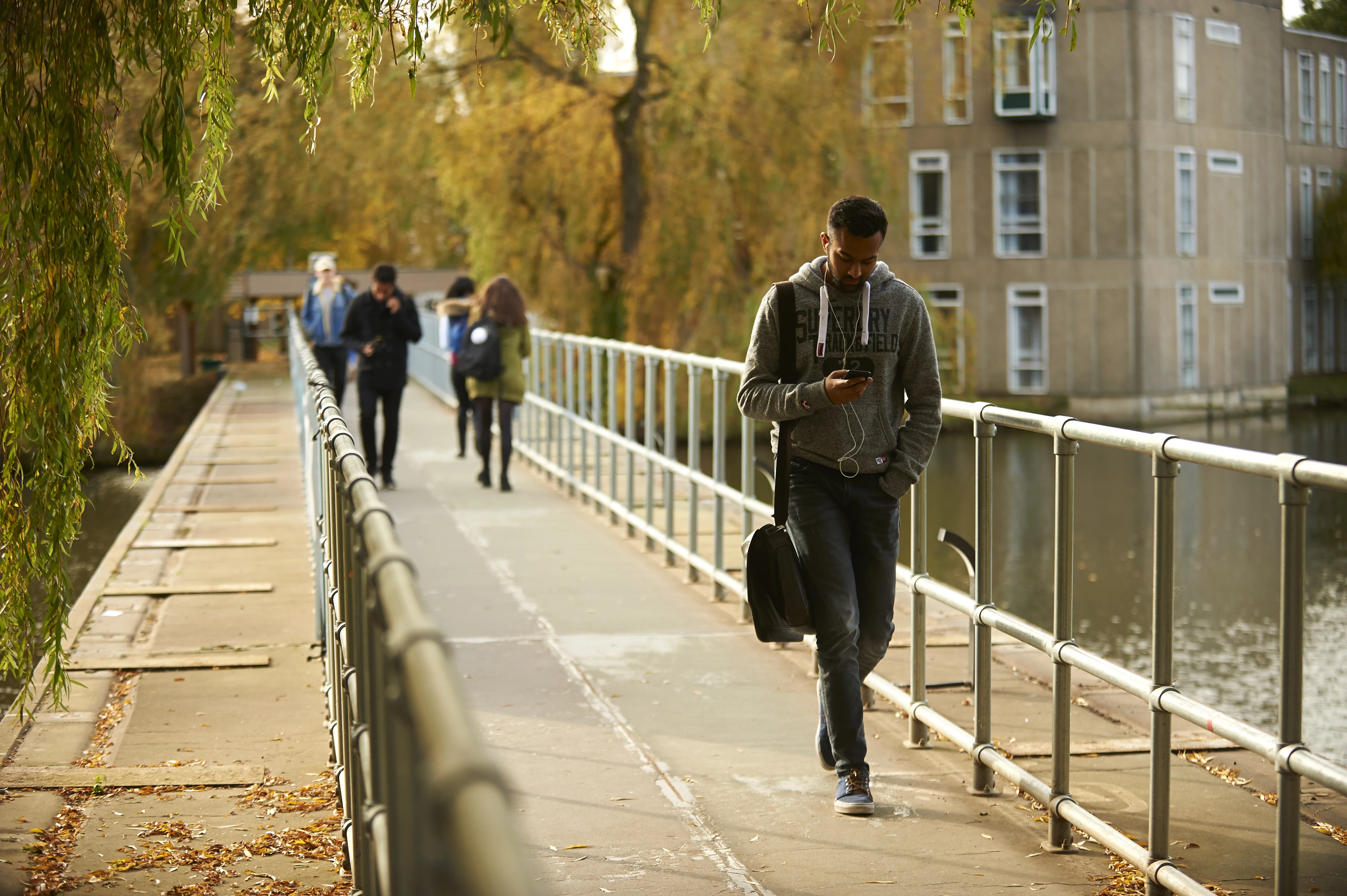 Student walking across a university campus