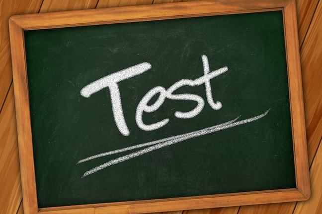 Schoolsign with 'test' wrote on it.
