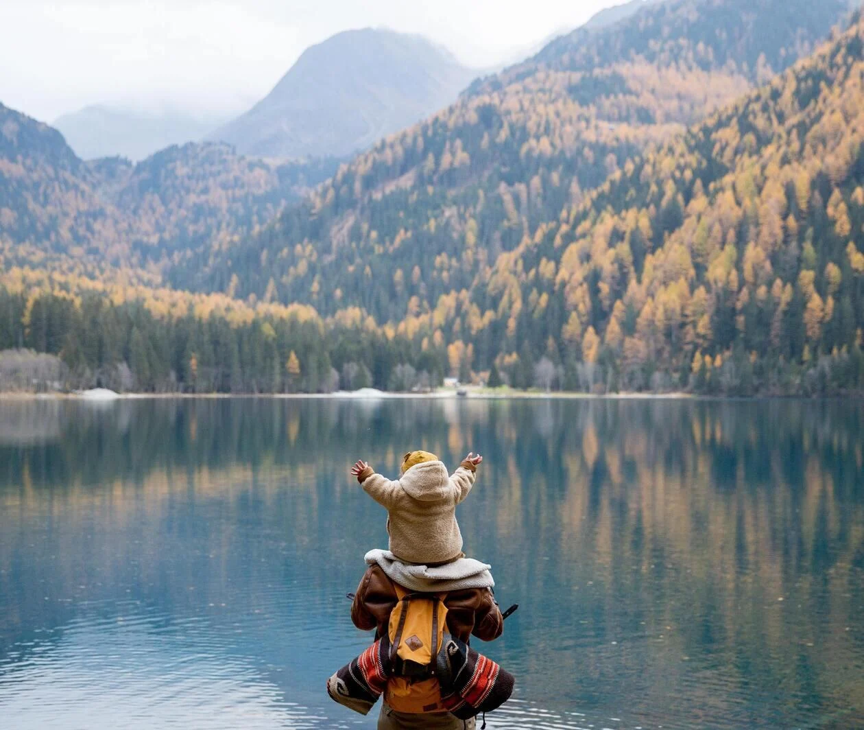 Child and Adult by a Lake