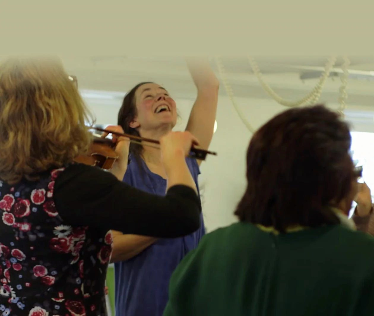 Photograph of people participating in a dance and music session