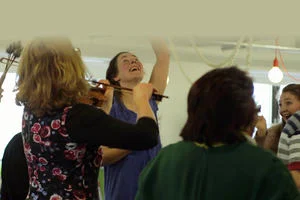 Photograph of people participating in a dance and music session