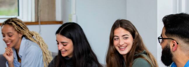 Photograph of 4 young people chatting
