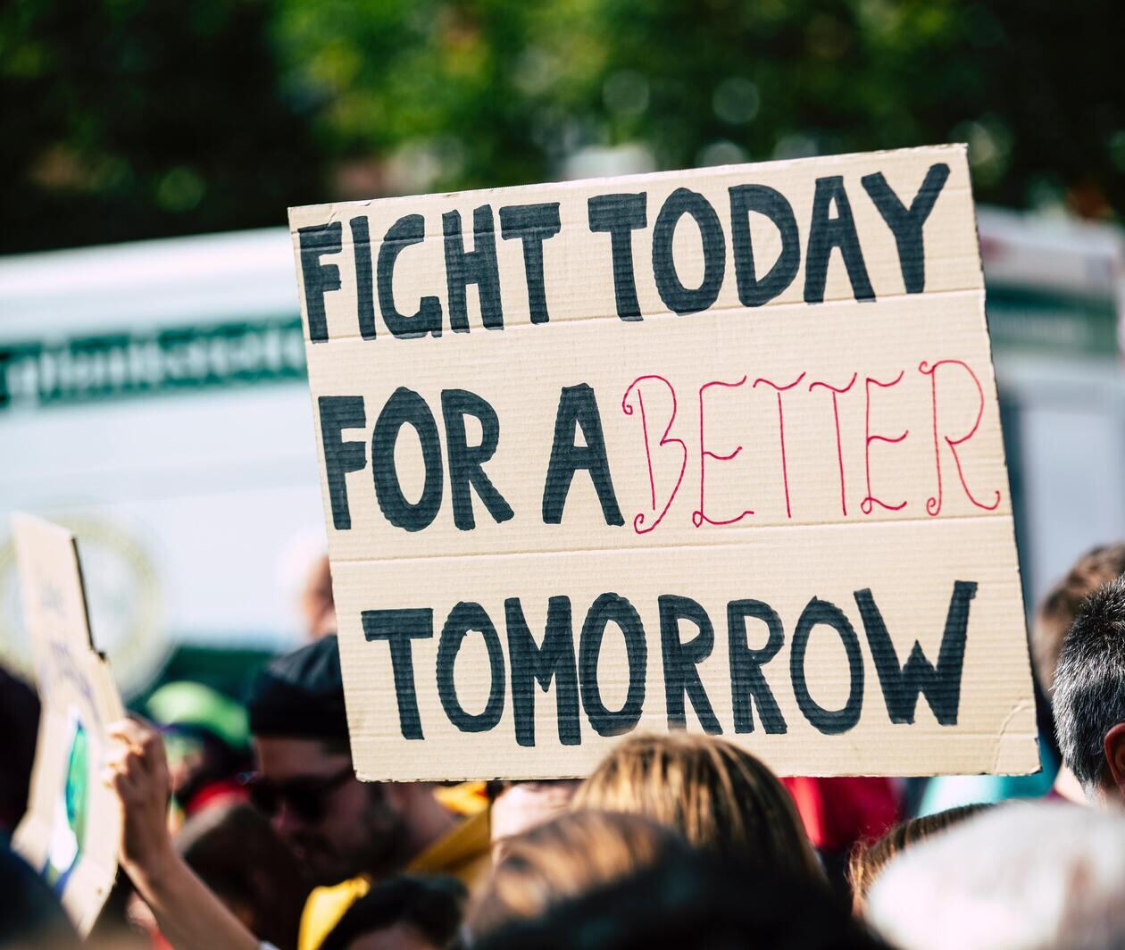 protest sign for climate action that says 'fight today for a better tomorrow'.