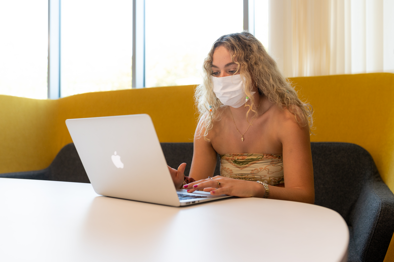 Student with mask on shopping online Student with mask on shopping online