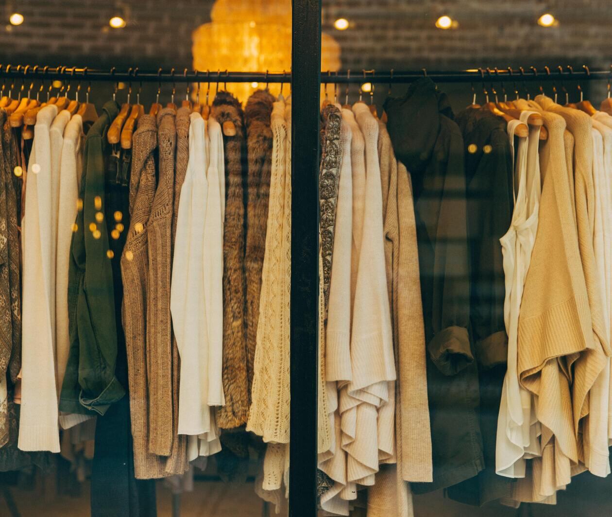 clothes in varying shades of yellow on a rack