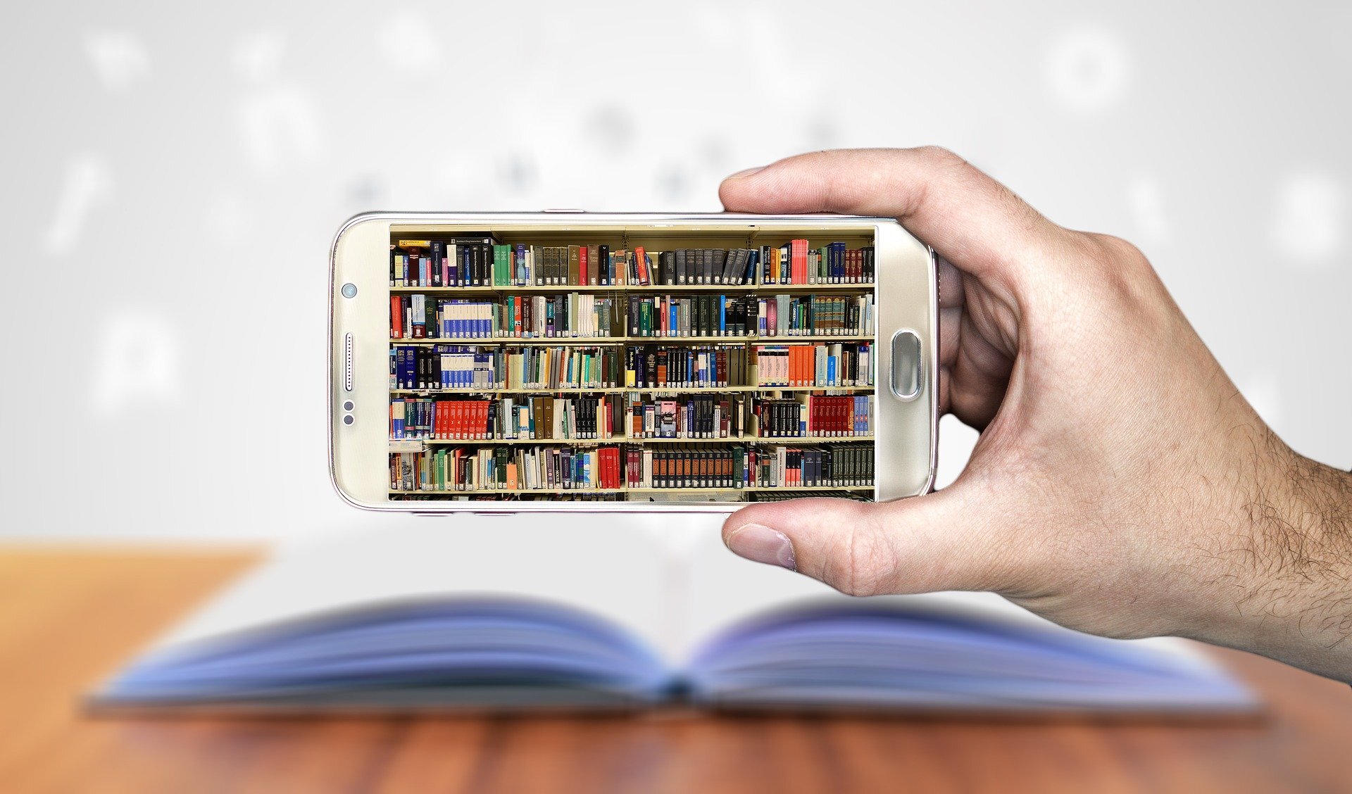 Smartphone pointed at a shelf full of books