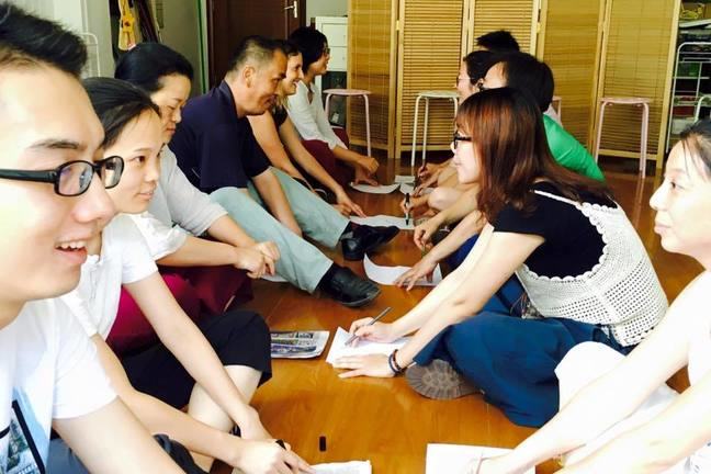 A group of people doing an activity in pairs