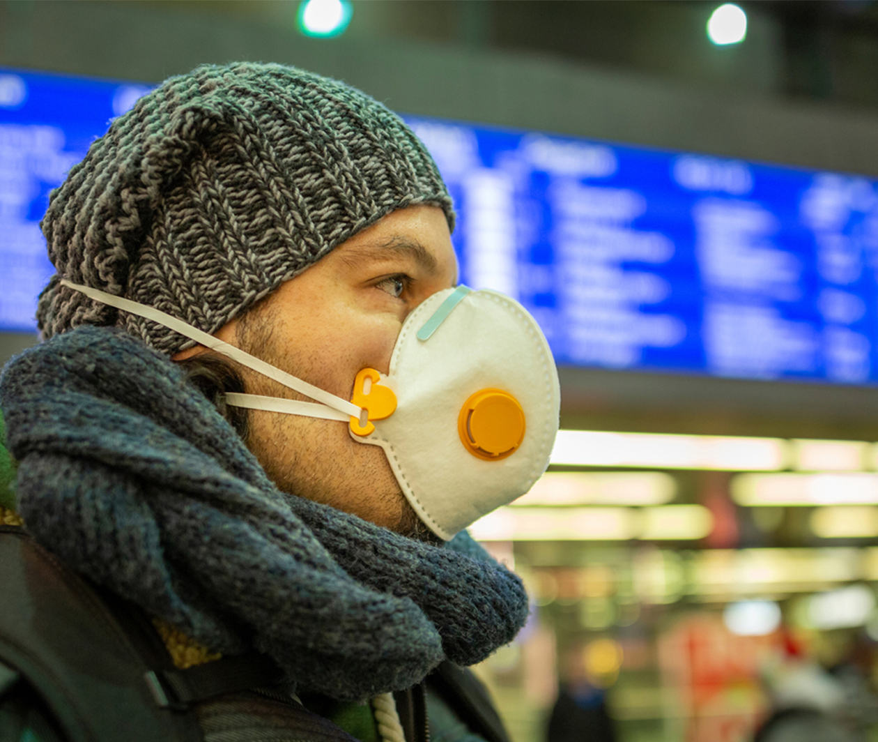 man with mask in an airport