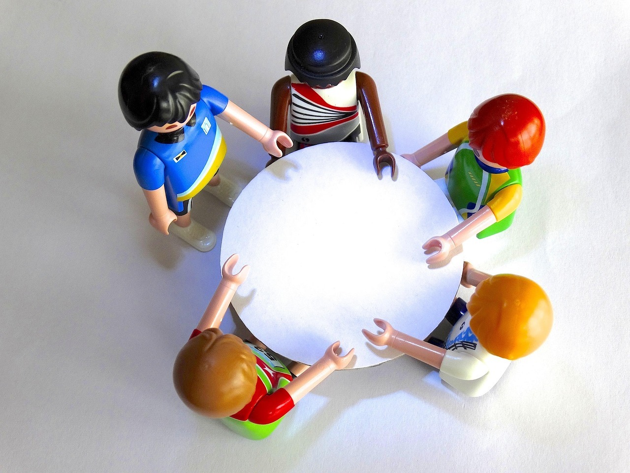 Playmobil characters around a table