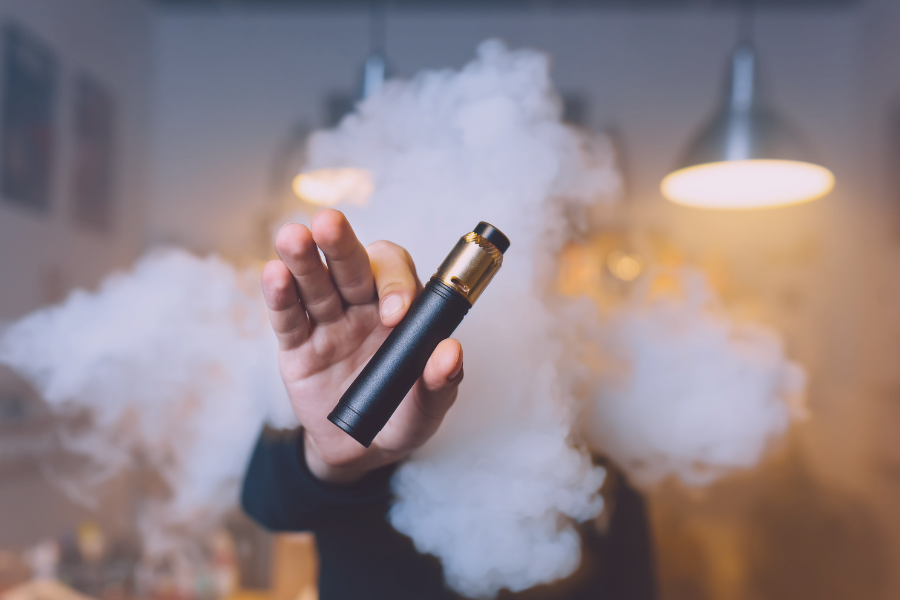 Man holding up e-cigarette