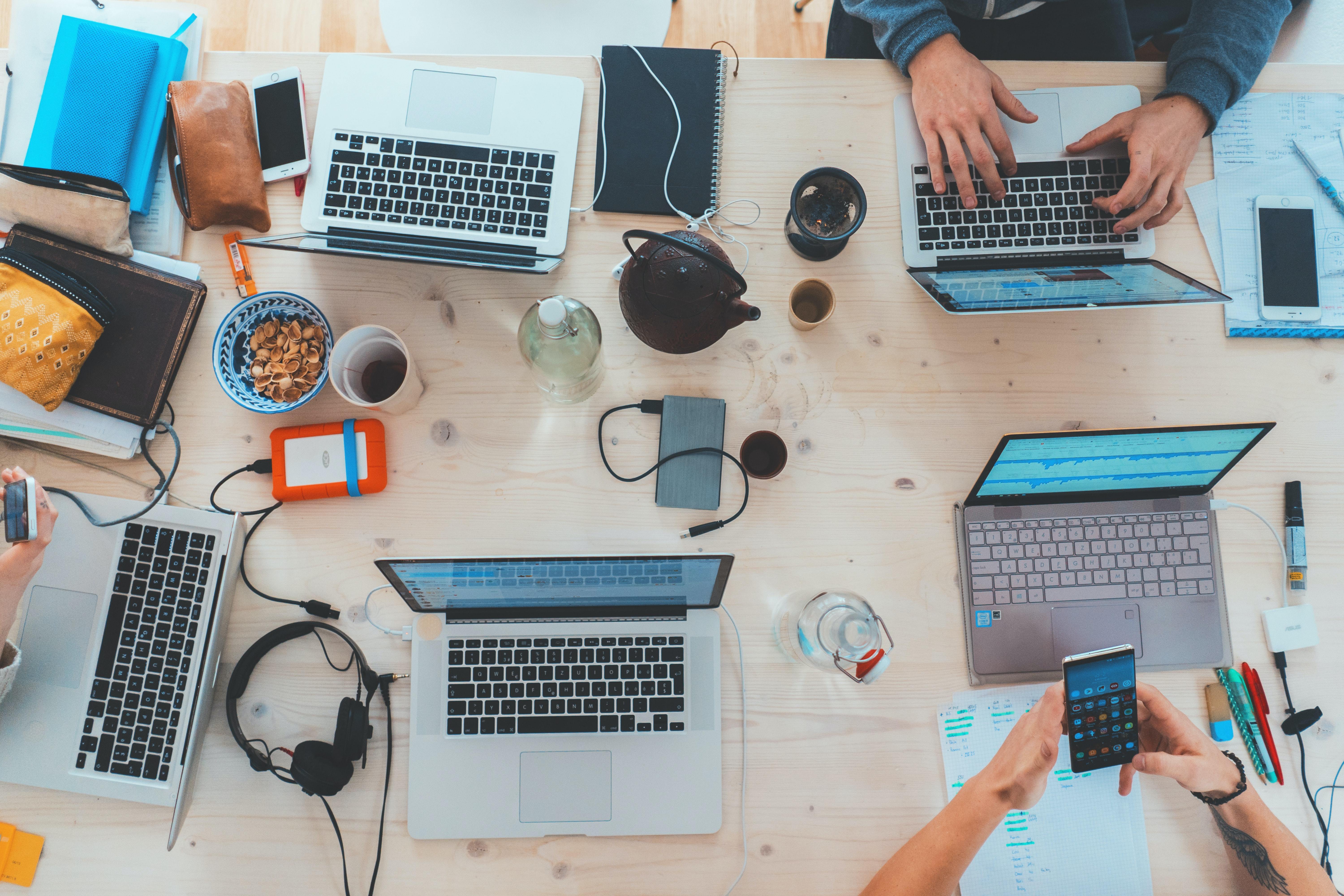 A group of people using laptops