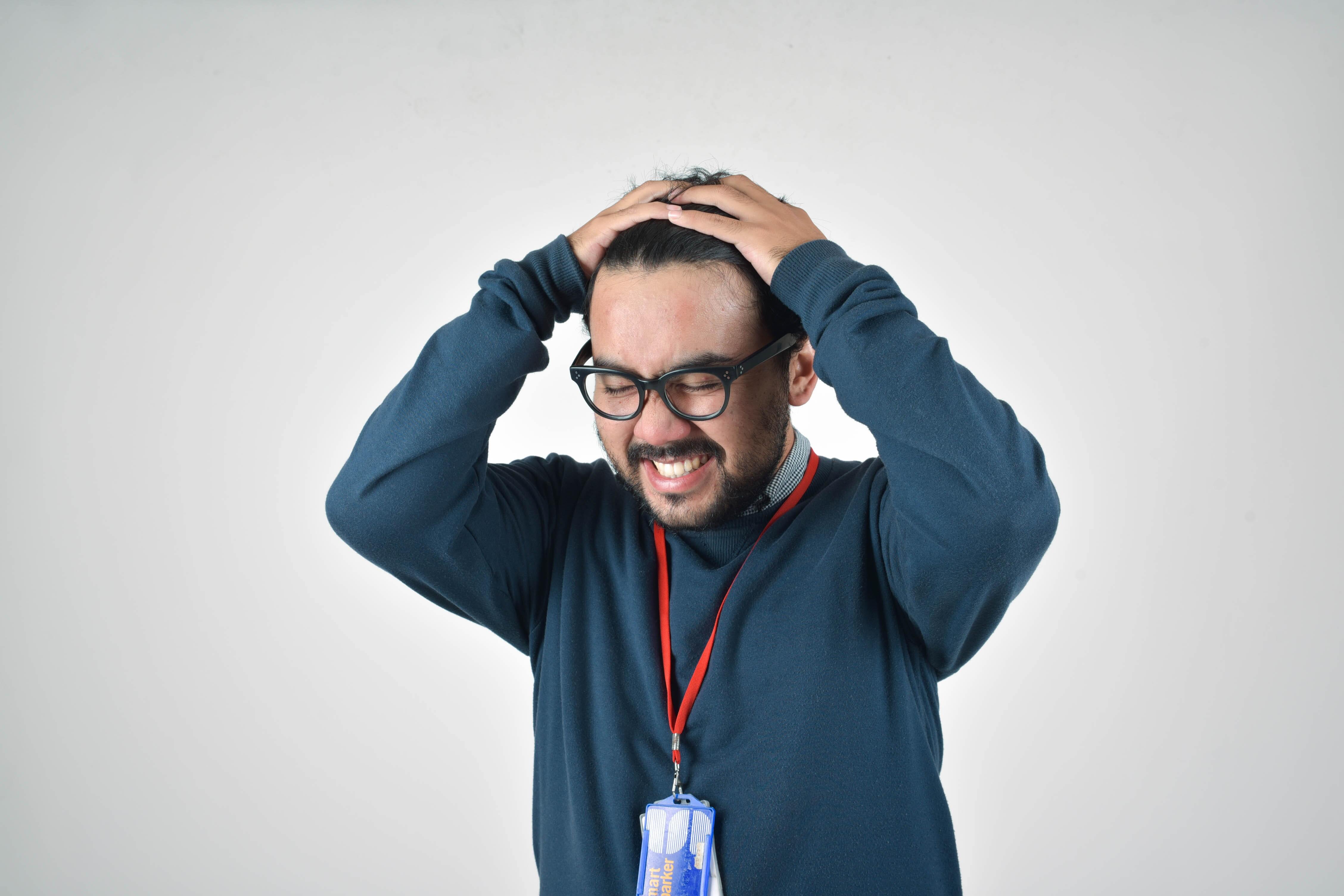 Man with his hands in his hair