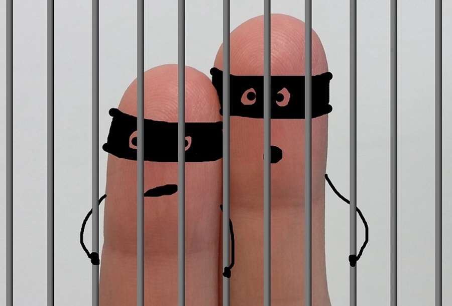 finger figures in a prison cell