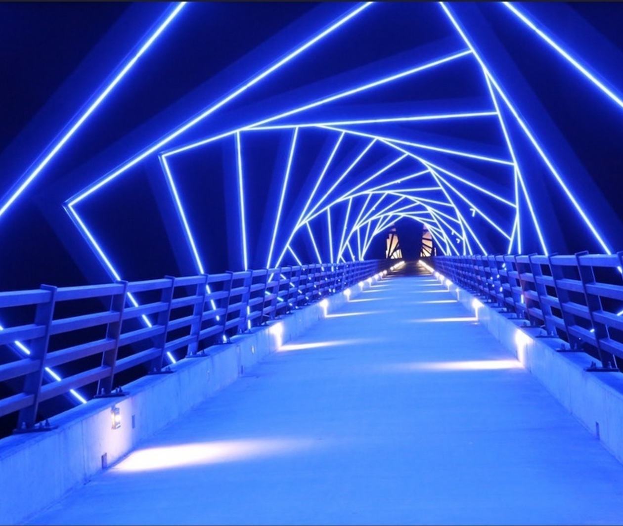 A corridor surrounded by blue lights. An infinite horizon.