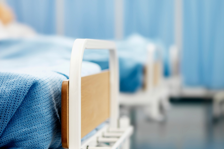 Faded image of the end of a hospital bed