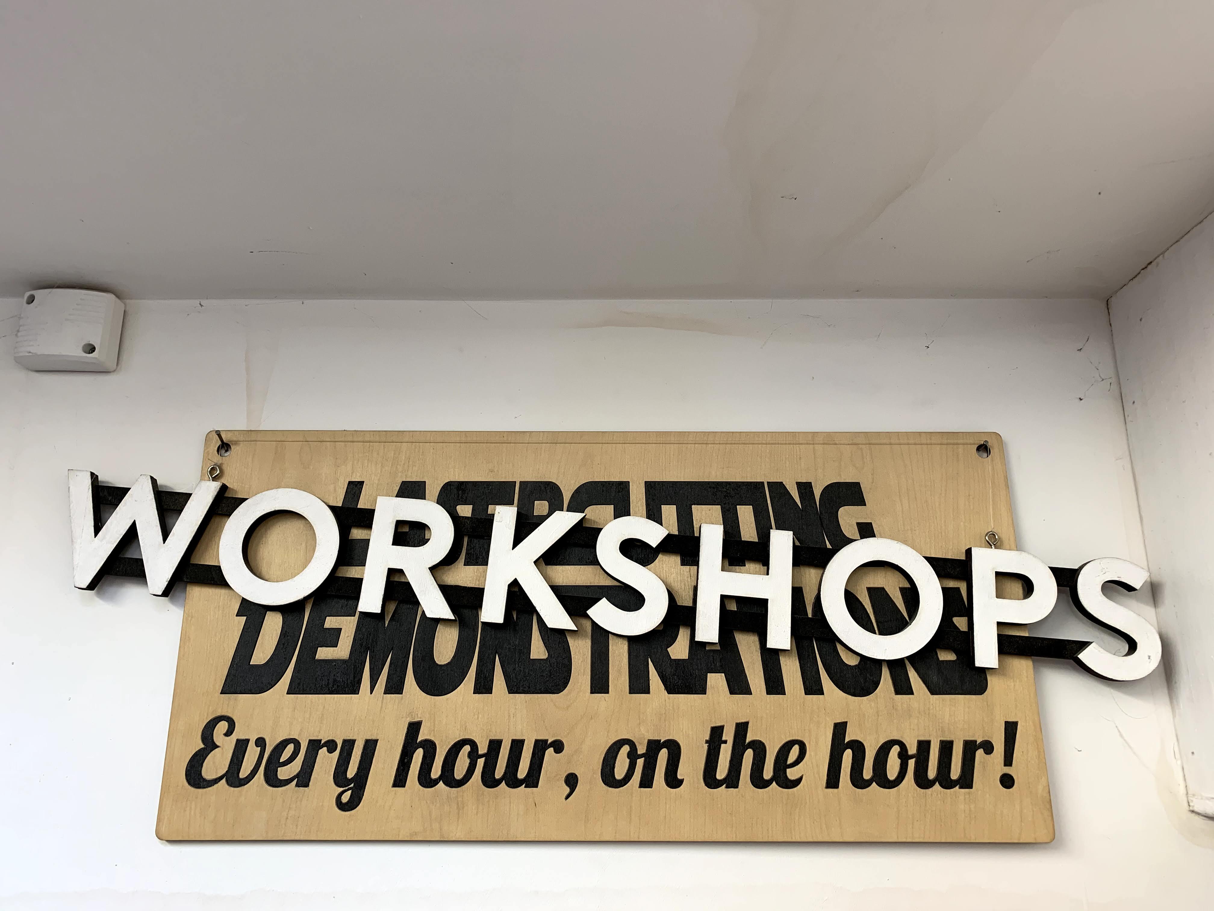 A handmade sign advertises workshop classes