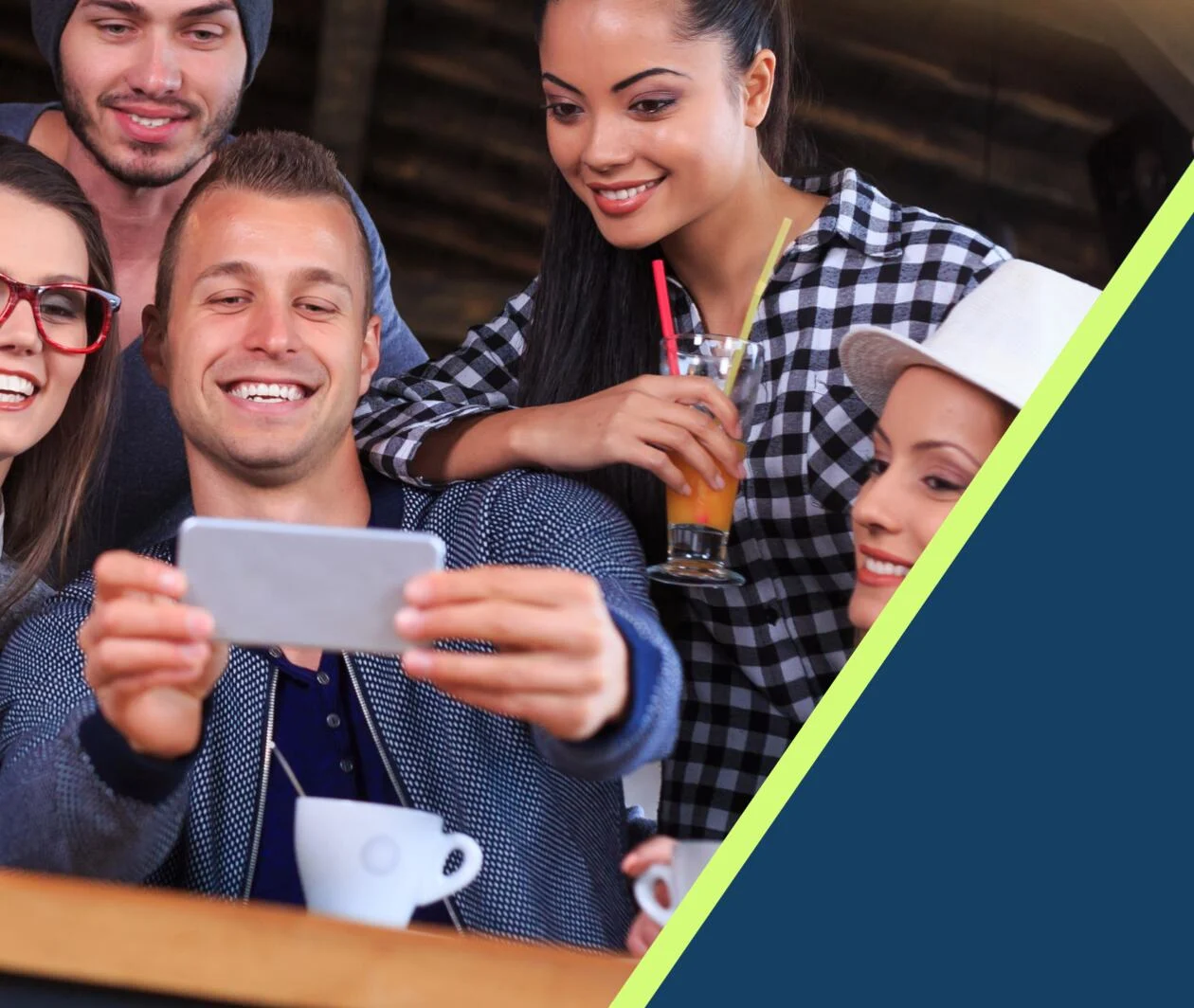 A group of happy people looking at a phone