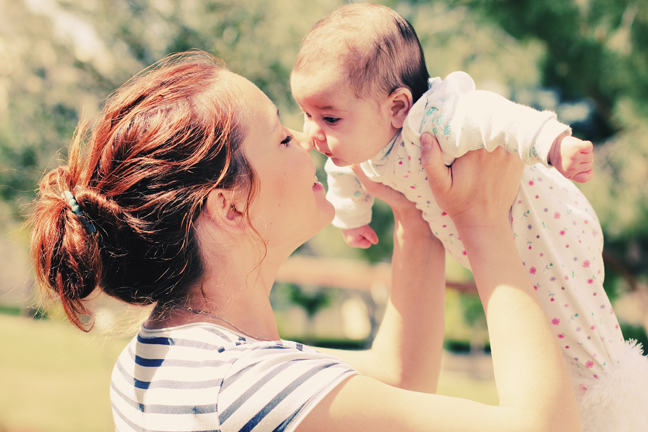 Mother smiling at her baby